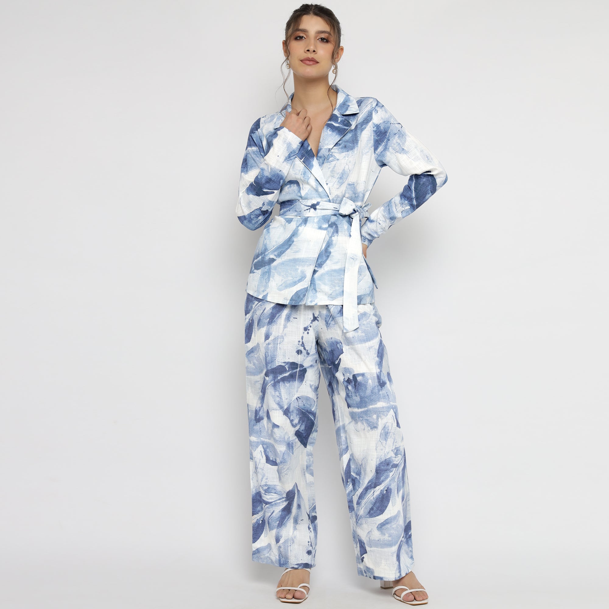 Model wearing a Blue & White Watercolor Printed Belted Blazer Co-ord Set featuring long sleeves and wide-leg pants – perfect for a chic and modern look.