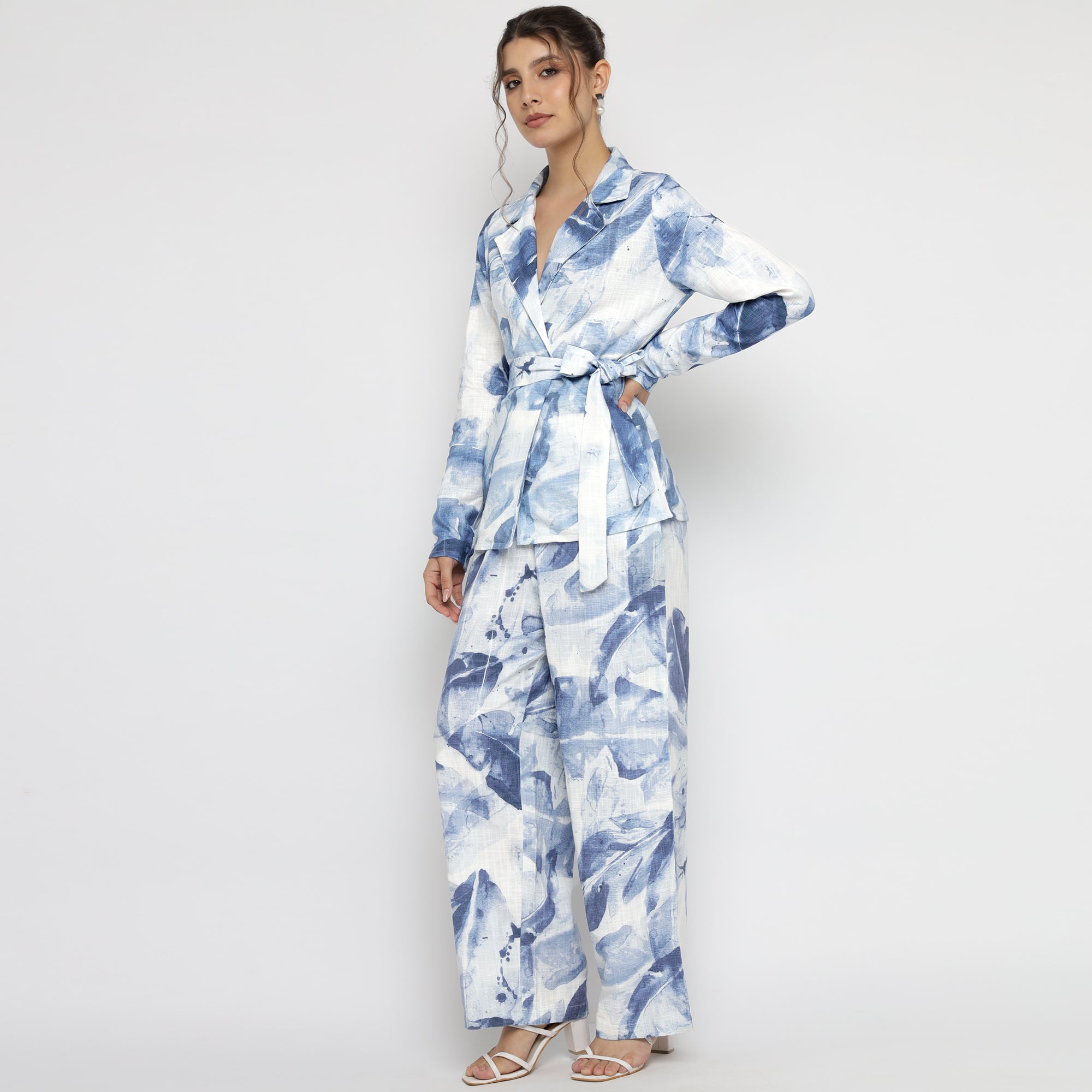 Model wearing full Blue & White Watercolor Printed Co-ord Set featuring belted blazer and wide-leg trousers.