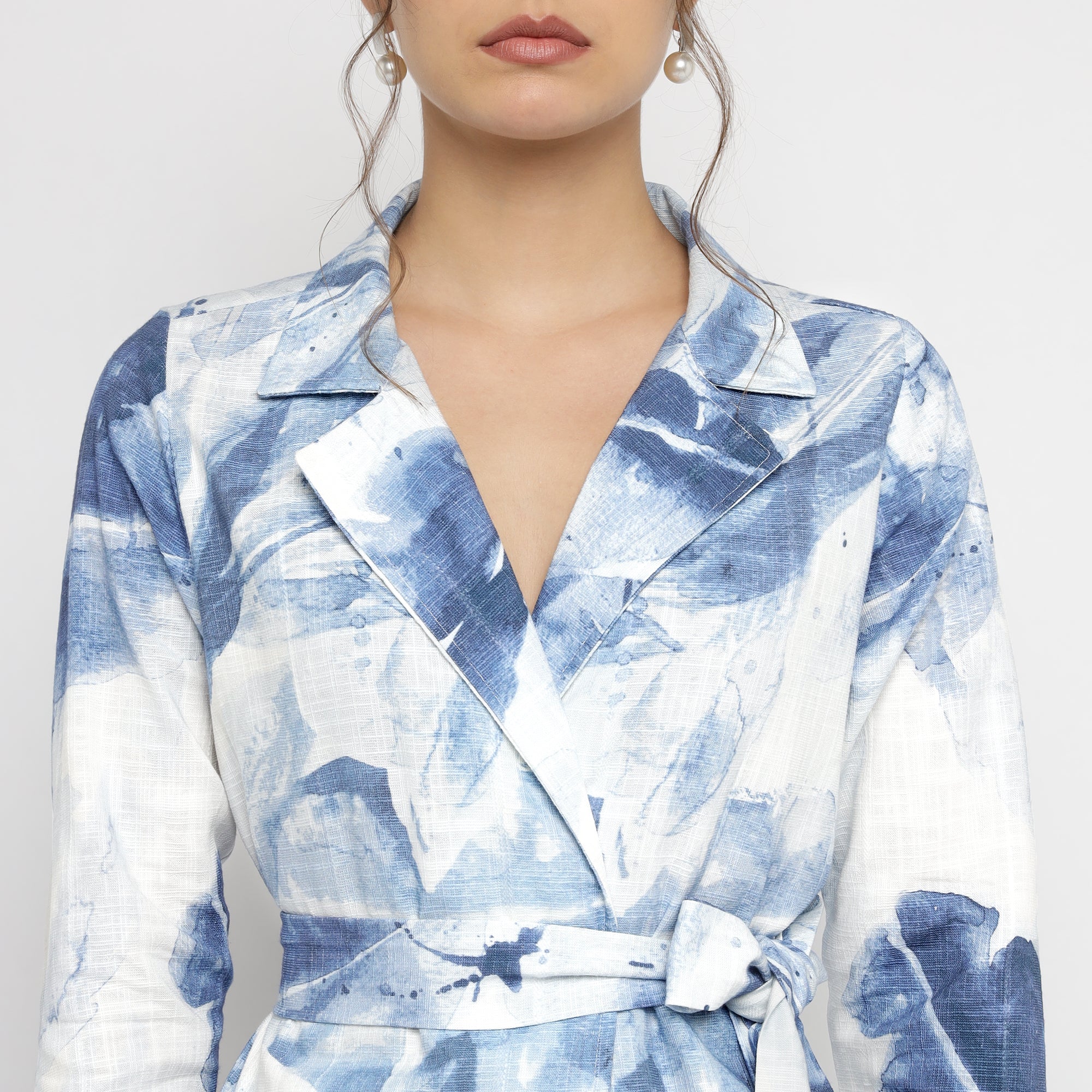 Close-up front view of Blue & White Watercolor Printed Blazer  showing lapel collar and waist tie detail.