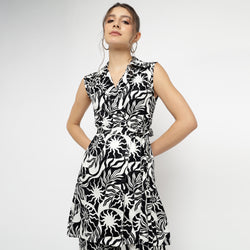 Woman wearing black and white abstract printed sleeveless co-ord set with V-neckline and tied waist – stylish modern outfit by The Ulluu